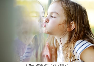 Asian girl kissing glass